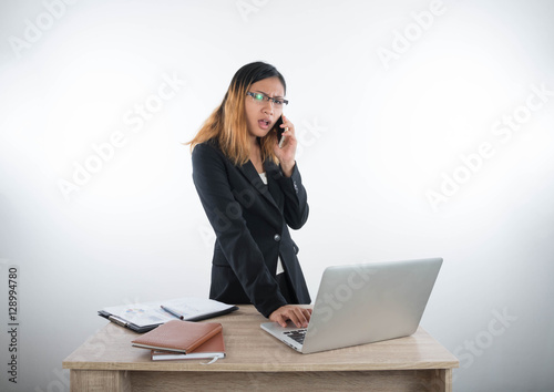 Young business woman with laptop notebook and smartphone in the