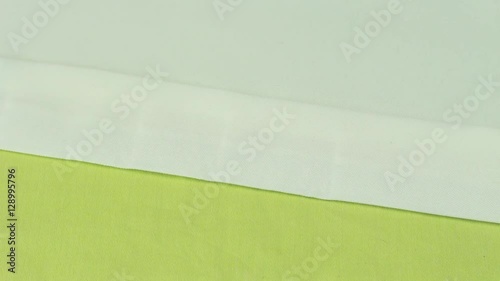Tailor Pulls Dressmaker Pins of Beige Fabric.