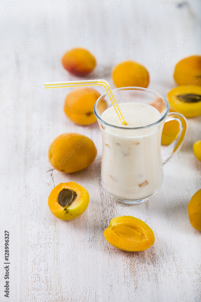 Fototapeta premium Smoothie or yogurt with blueberries on a wooden table. Delicious
