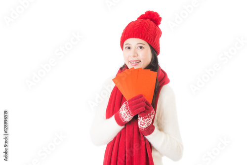 pretty chinese young woman holding red lucky money