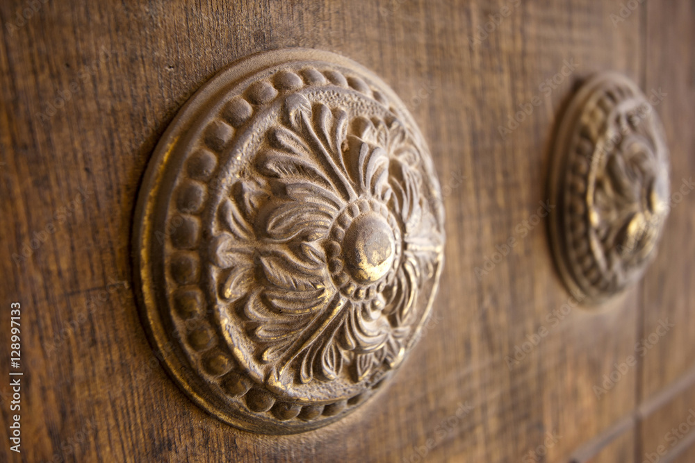 Ornate decorative element of wood on the door