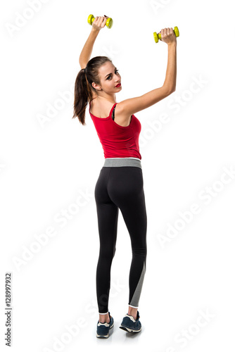 Pretty sport woman making weightlifting