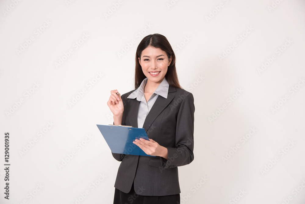 Business woman standing with pen and clipboard on her hands. Business woman standing with pen and clipboard on her hands.