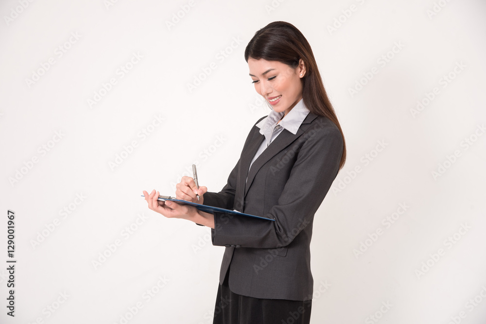 Businesswoman with clipboard and pen over white background. Businesswoman with clipboard and pen over white background.