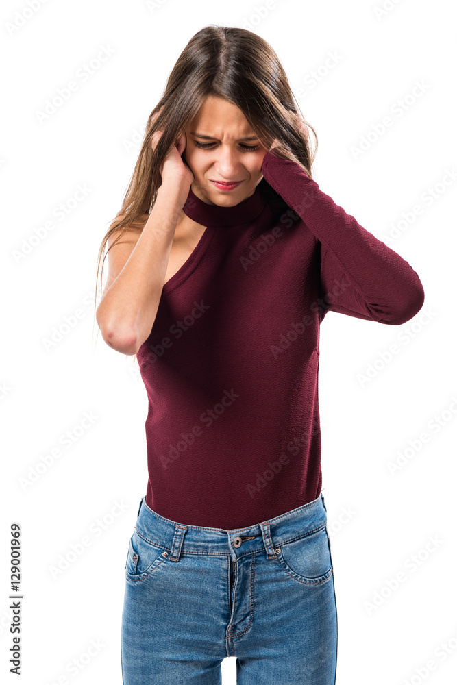 Young teenager girl covering her ears Young teenager girl covering her ears