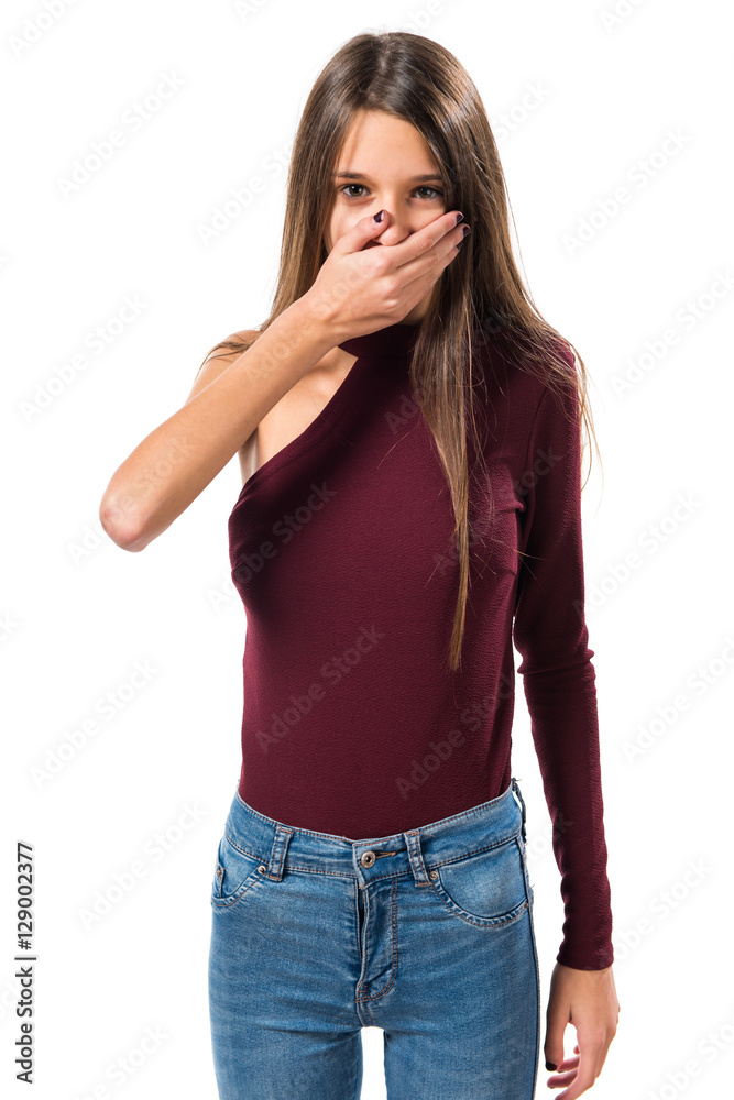 Young teenager girl covering her mouth Young teenager girl covering her mouth