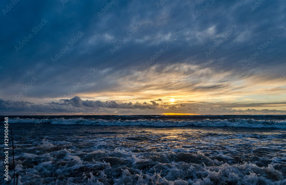 Stormy sunset in the beach