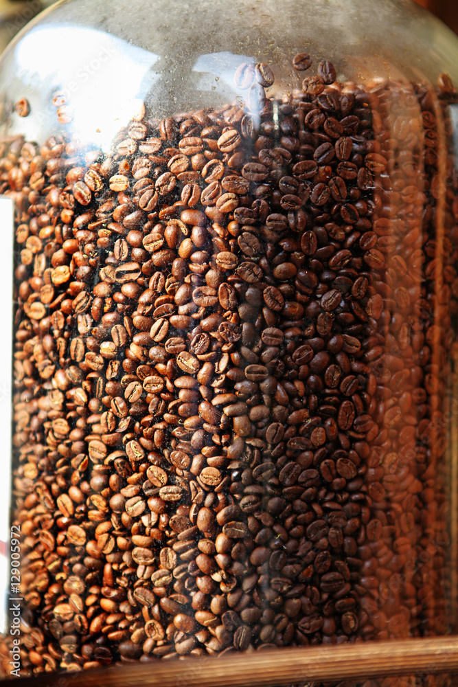 Obraz premium coffee beans in glass container