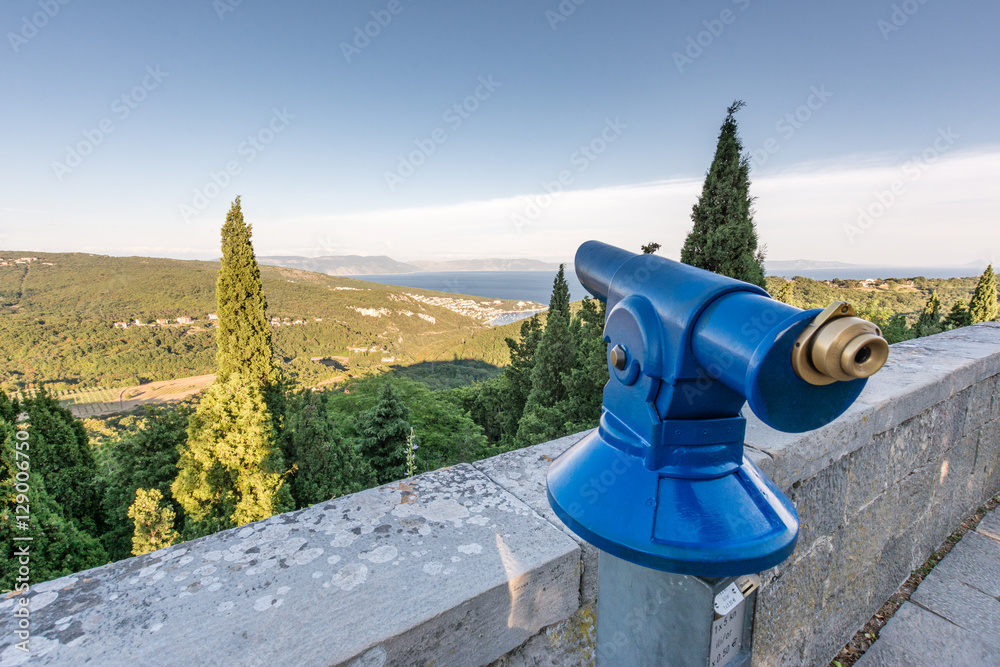 Close up from modern blue telescope with nice view from Labin croatia Close up from modern blue telescope with nice view from Labin croatia