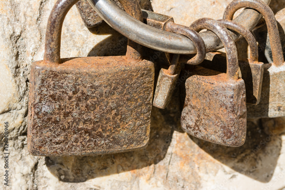 Close up from som old and rusty padlocks Close up from som old and rusty padlocks