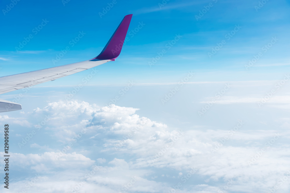 Airplane wing above the sky with cloud. Travel background. Airplane wing above the sky with cloud. Travel background.