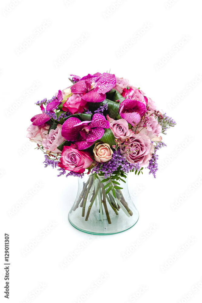 Wedding bouquet made of pink roses and orchids