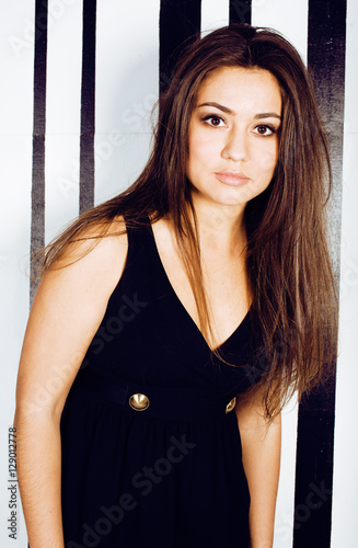 young pretty cool fat brunette woman with long hair fashion dressed in little black dress happy smiling, lifestyle people concept photo