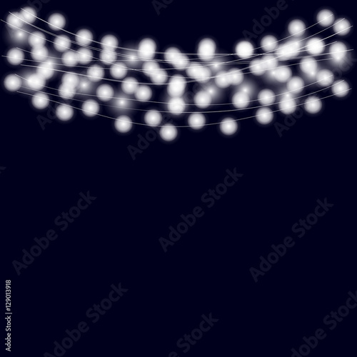 Christmas lights on the blue background realistic design element