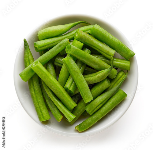Bowl of green beans isolated on white from above