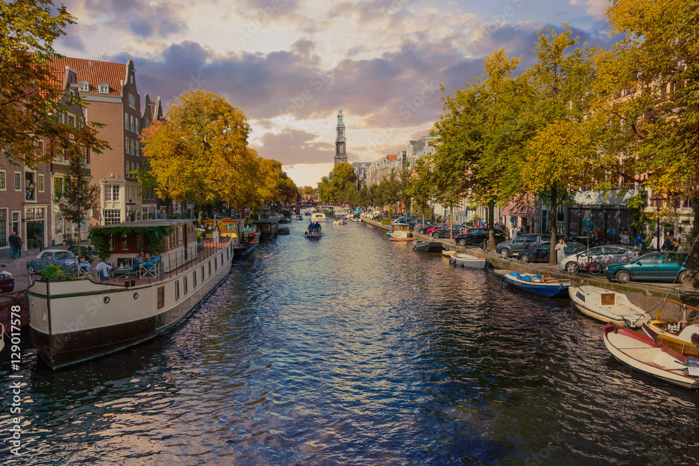 Panorama of canal in old town at fall, day time in Amsterdam.
