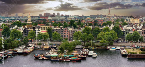 Photography Aerial view of old Amsterdam city with stormy clouds