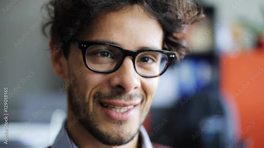 smiling young man in eyeglasses smiling young man in eyeglasses