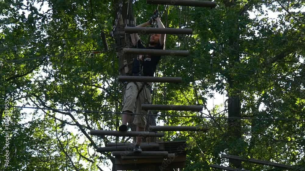 Man Moving on the Hanging Bars. Man Moving on the Hanging Bars.