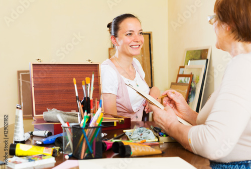 Artist draws a portrait of a woman photo