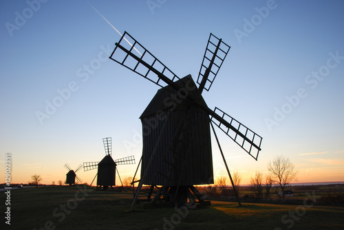 Old windmills in a row at twilight