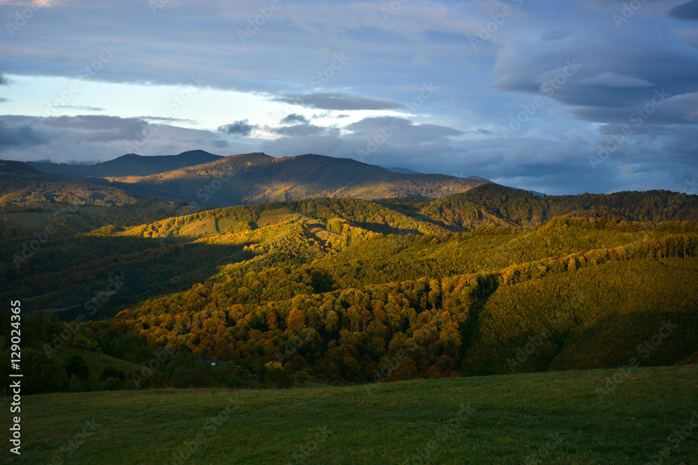 Fototapeta premium Evening sunset on mountain hills of Simon village. Bran.