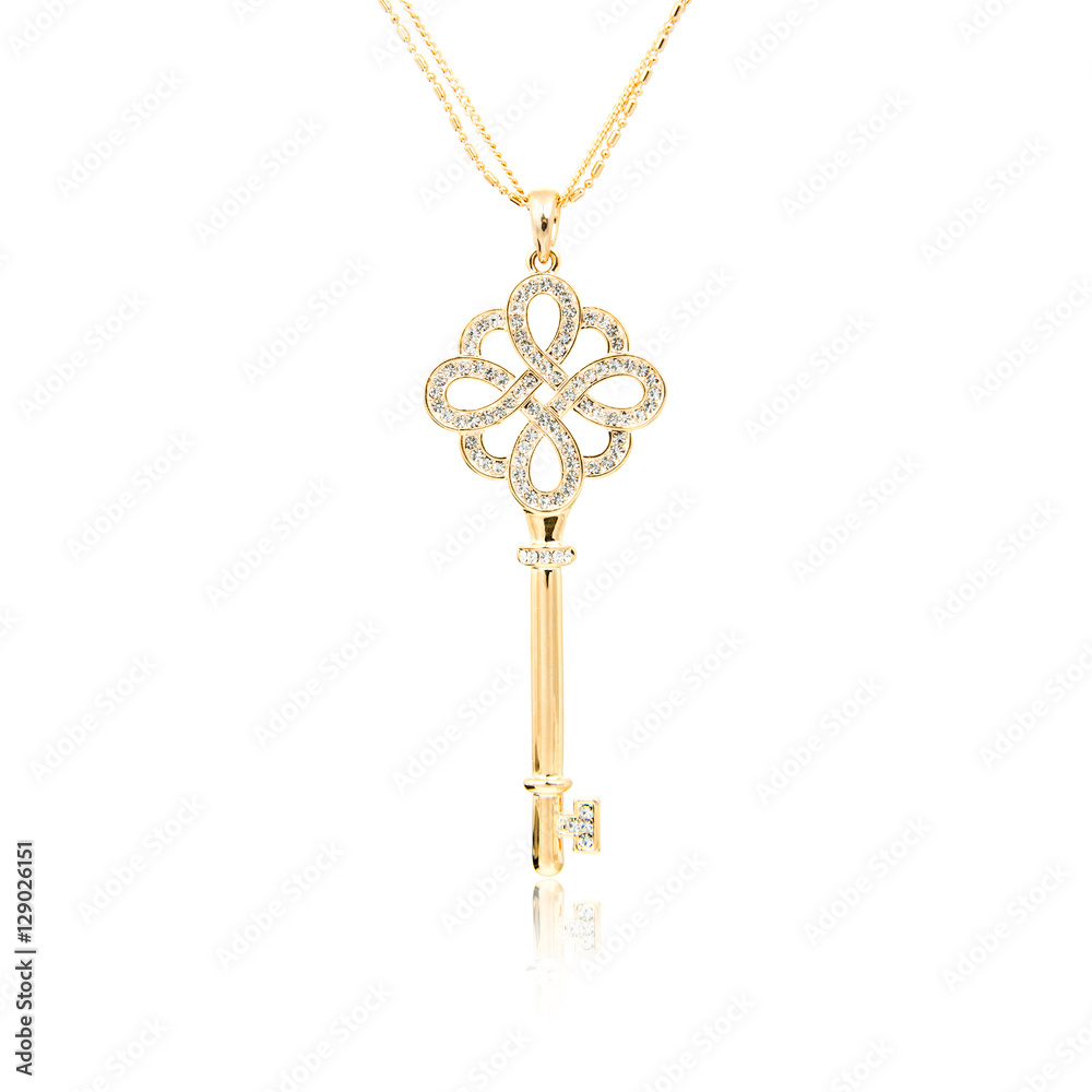 Golden diamond key pendant isolated on white Golden diamond key pendant isolated on white