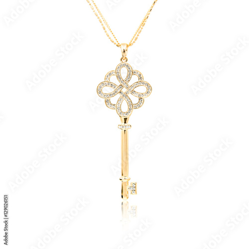 Golden diamond key pendant isolated on white