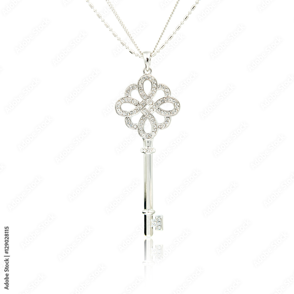 Silver diamond key pendant isolated on white