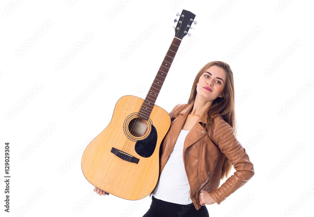 Young woman holding a guitar Young woman holding a guitar