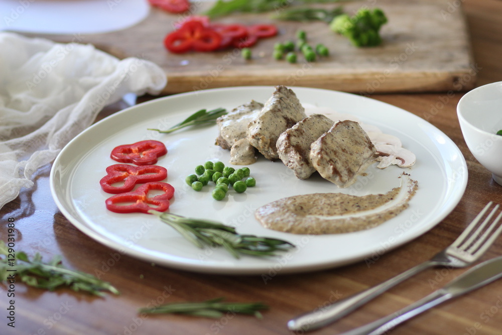 meat with sauce and vegetables
