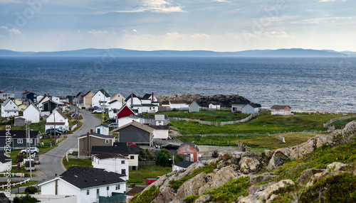 Bonavista, Newfoundland, Canada, on mid summer overcast day.   Village community alongside the sea.  People staying inside on blustery day.