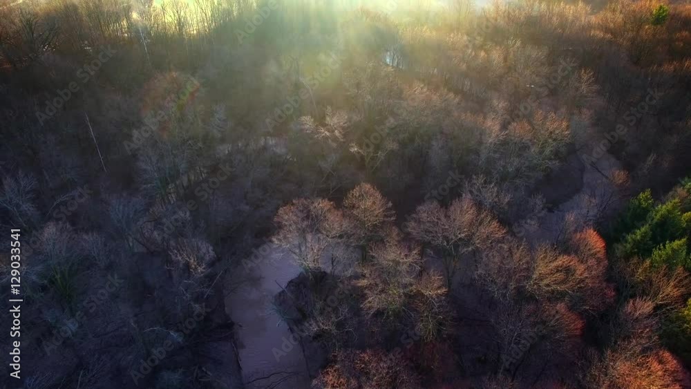 Sunrise Aerial looking down on foggy landscape, winding river.
Sunrise Aerial looking down on foggy landscape, winding river.