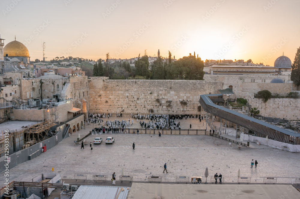 Fototapeta premium Sunrise over the Old City of Jerusalem Israel near the western wall and the dome of the rock