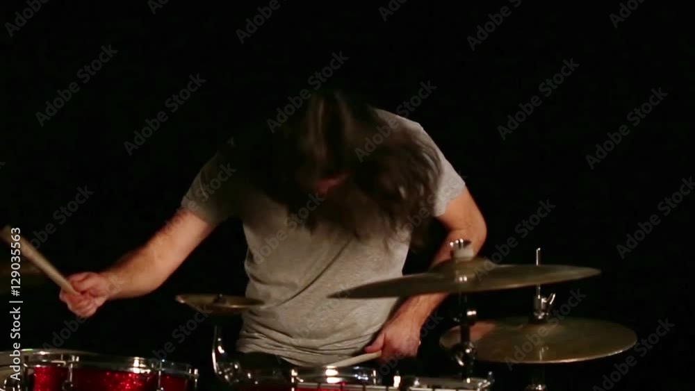 Bearded drummer playing drums Bearded drummer playing drums