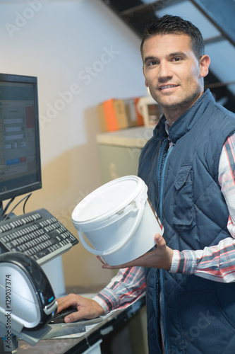 a hardware store assistant seaching for a code photo