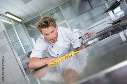 kitchen chef cleaning the restaurants kitchen