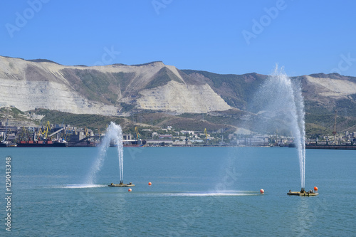 Fountains in the sea. Spray fountains in the bay. Sea port