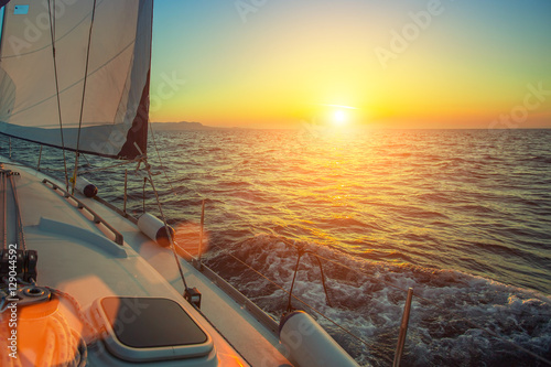 Ship yachts in the open Sea during amazing sunset. Sailing. Luxury boats.