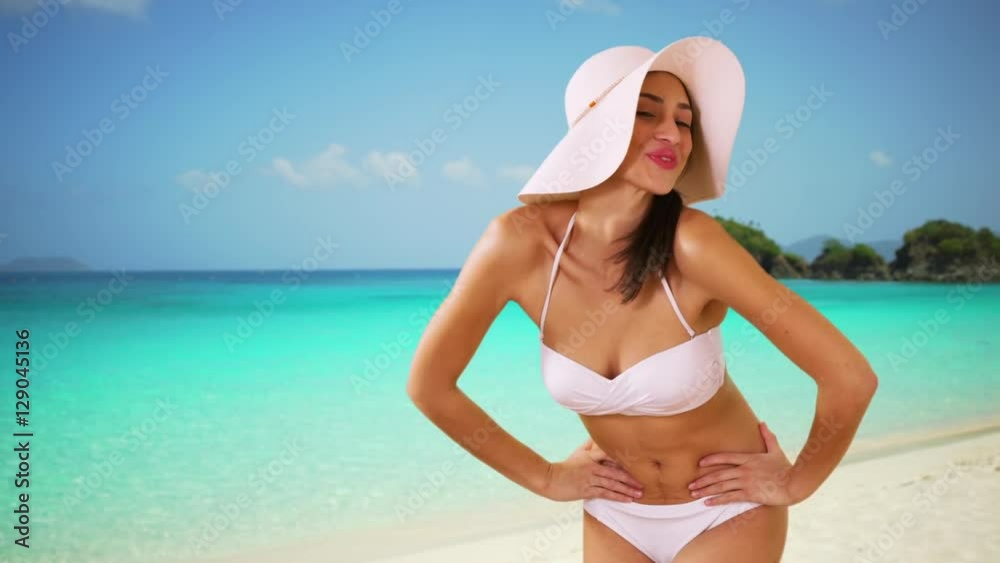 A Hispanic girl dances on the Caribbean beach A Hispanic girl dances on the Caribbean beach