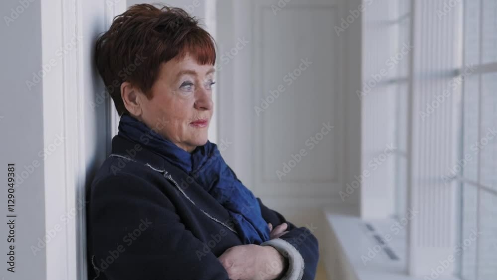 Looking old woman portrait on a white background happy portrait Looking old woman portrait on a white background happy portrait