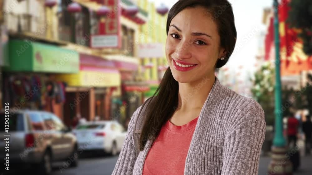 A Hispanic girl poses for a portrait in china town A Hispanic girl poses for a portrait in china town