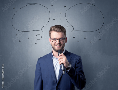 Businessman holding microphone