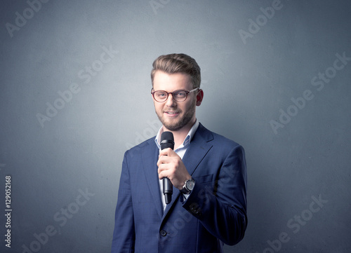 Businessman holding microphone