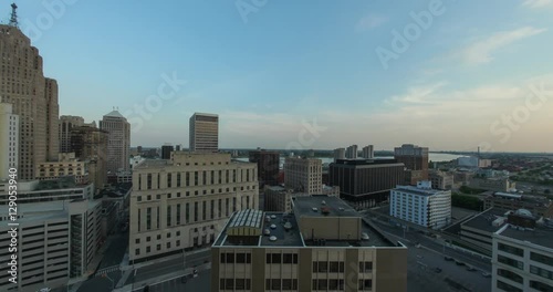 Timelapse of the Detroit skyline from day to night, highlighting the illumination of the buildings during sunset and twilight 