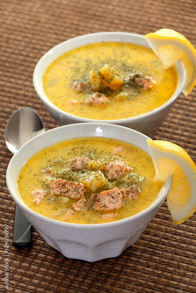Fish soup from salmon, potatoes, leek and sour cream. Topped wit Fish soup from salmon, potatoes, leek and sour cream. Topped wit