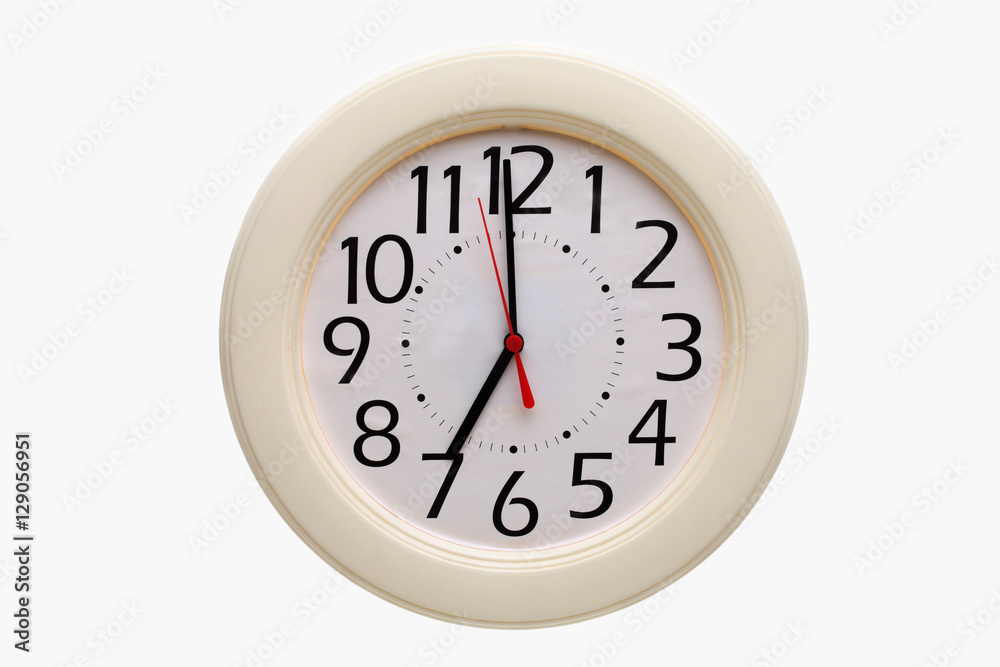 Analog wall clock showing 7:00 o'clock Analog wall clock showing 7:00 o'clock