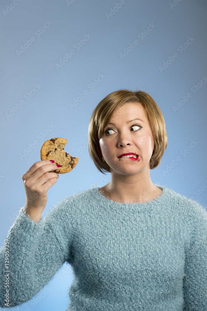 cute beautiful woman with chocolate stain in mouth eating big delicious cookie cute beautiful woman with chocolate stain in mouth eating big delicious cookie
