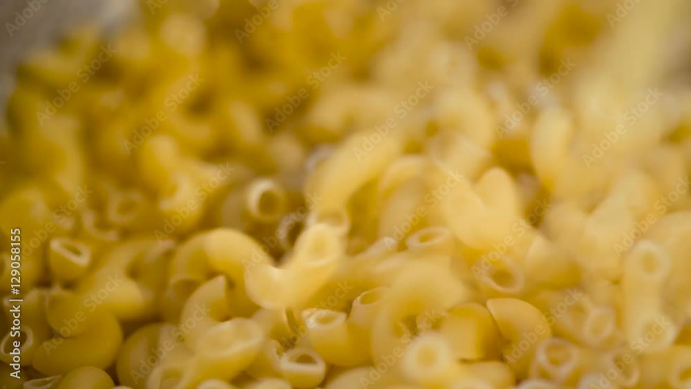 Dry Italian pasta pouring in a heap Dry Italian pasta pouring in a heap