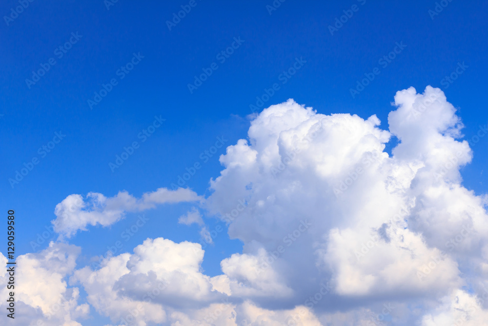 Blue sky background with white clouds and rain clouds. The vast blue sky and clouds sky on sunny day. White fluffy clouds in the blue sky. Blue sky background with white clouds and rain clouds. The vast blue sky and clouds sky on sunny day. White fluffy clouds in the blue sky.